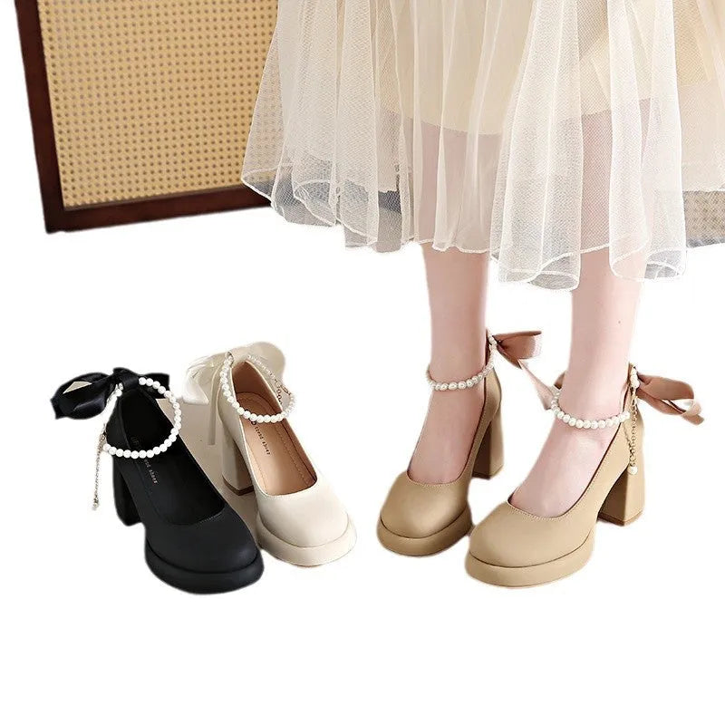 Women's beige Mary Jane shoes with chunky heel and ankle strap buckle showing round toe design