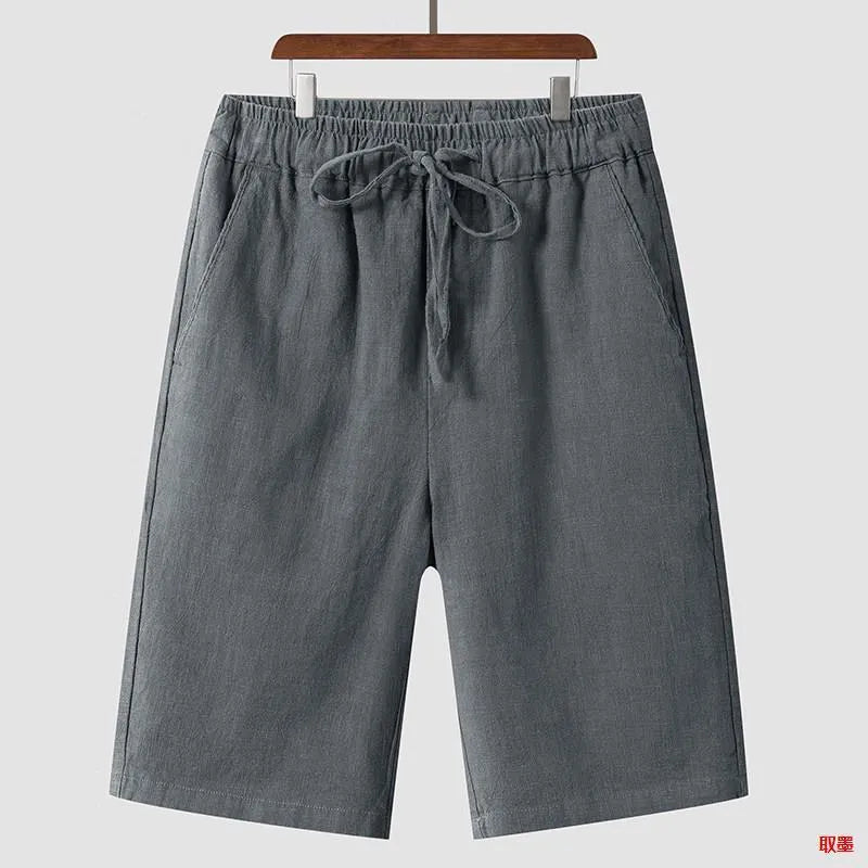 Men's beige linen loose cropped casual shorts on a neutral background.
