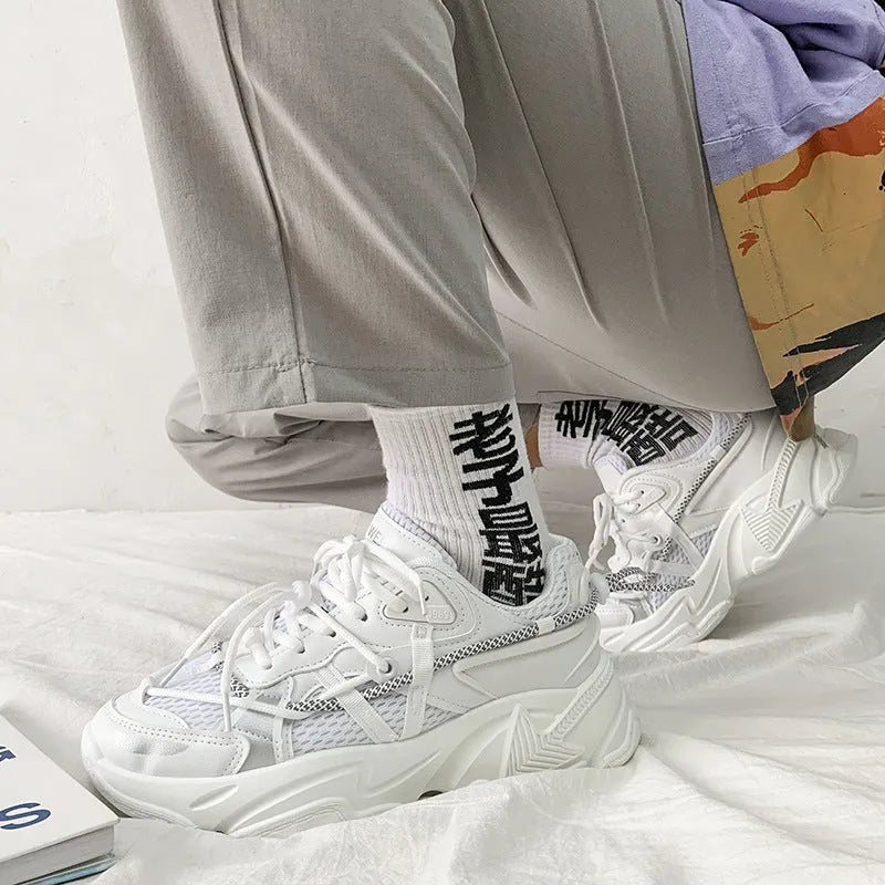 Men's white platform dad shoes in Korean style with front lace-up and mesh lining.