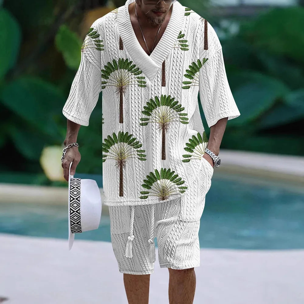 Man wearing a loose-fitting casual short sleeve suit with matching shorts in a solid colour.