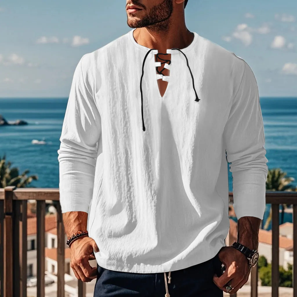 Cotton linen blend solid colour beach shirt in a loose pullover style on a hanger.