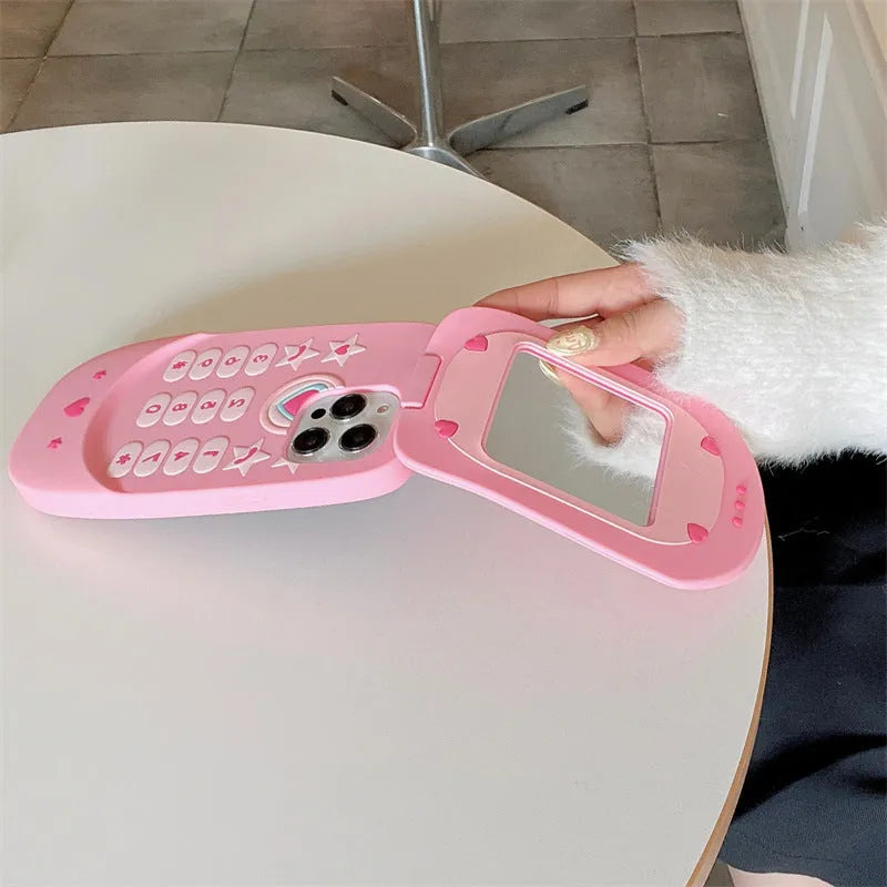 Light pink silicone flip phone case with a mirror, shown next to a rose red version, for iPhone models.