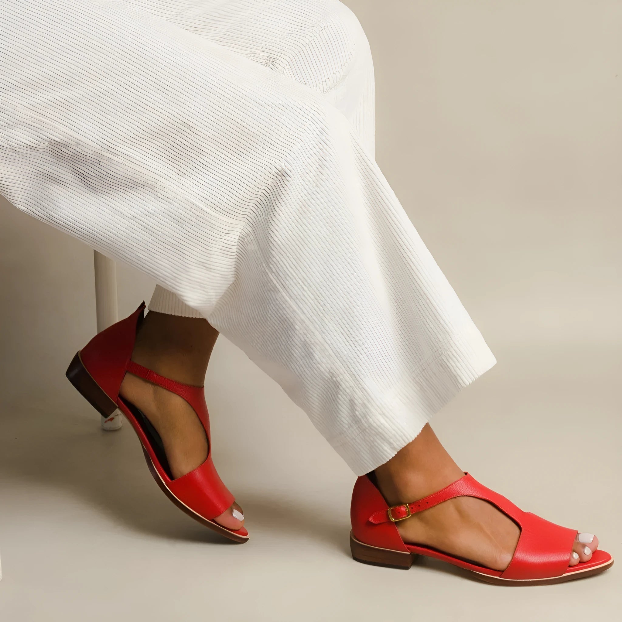 Red women's plus size casual sandals with a square buckle and herringbone toe holder.