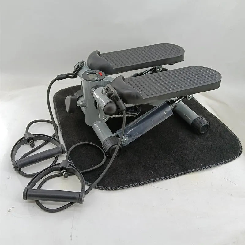 Silver grey household mini treadmill with hydraulic resistance system for waist slimming.