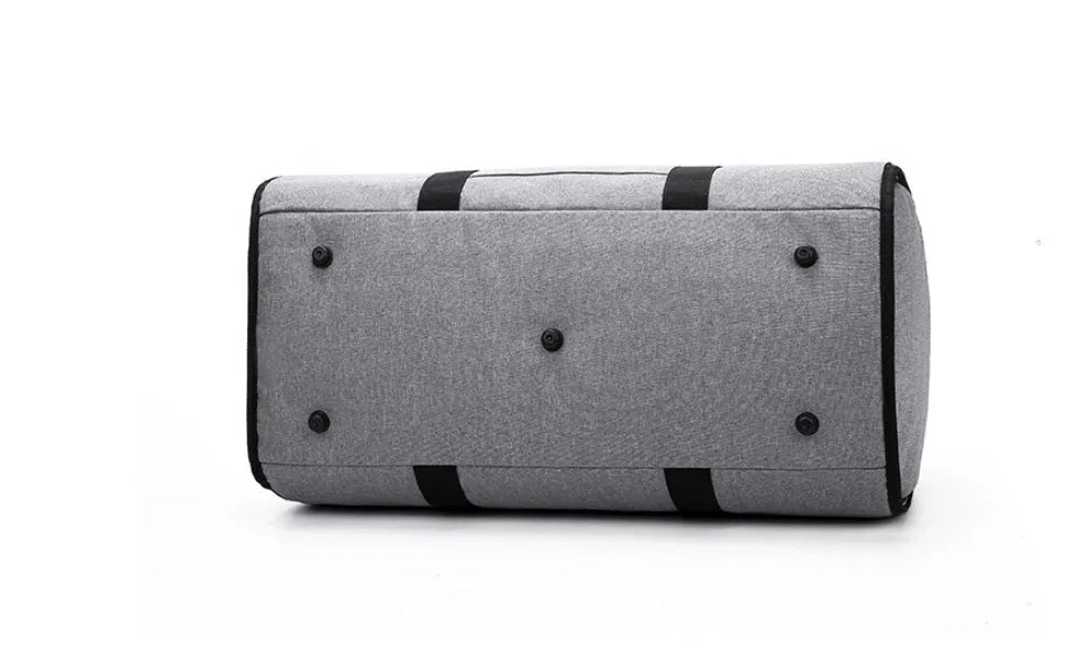 Medium-sized red cylinder travel bag with a zipper opening and carry handles.
