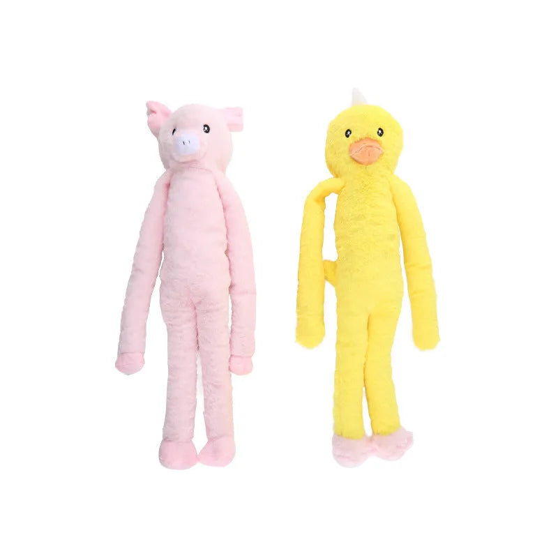 Pink and yellow golden retriever plush dog toy with squeaker and rattle.