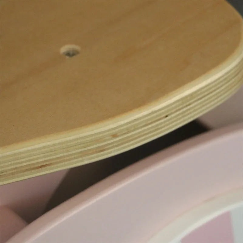 Pink wooden balance scooter for toddlers aged 1 to 6 years.