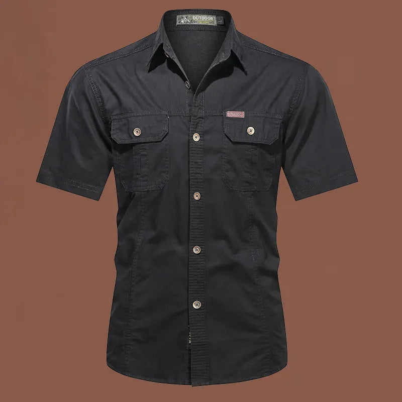 Men's army green cotton work shirt with short sleeves and non-iron finish on a hanger.