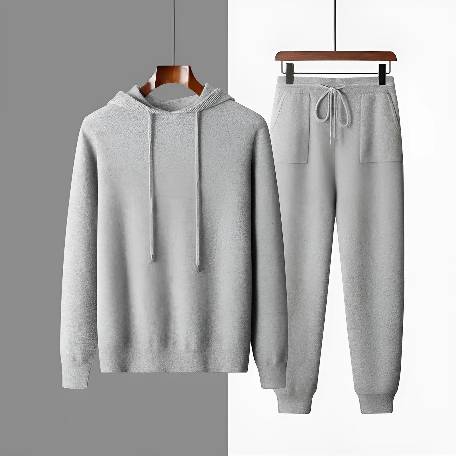 Men's light gray cashmere hooded sweatshirt and long pants set on a hanger.