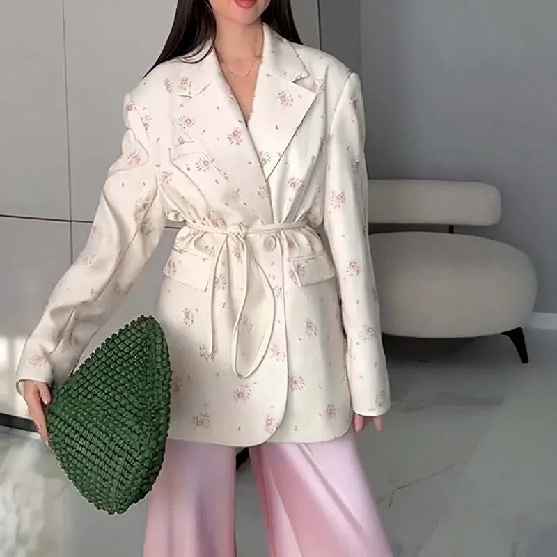 Women's white polyester suit jacket with a lace-up detail cinching the waist.