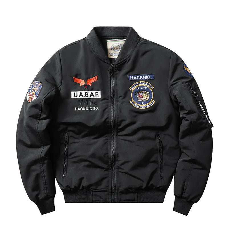 Man wearing a slim-fit black retro motorcycle jacket with stand collar and embroidery details.