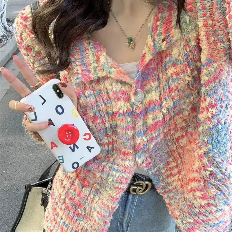 Pink or green retro-style rainbow patterned knitted cardigan on a model.