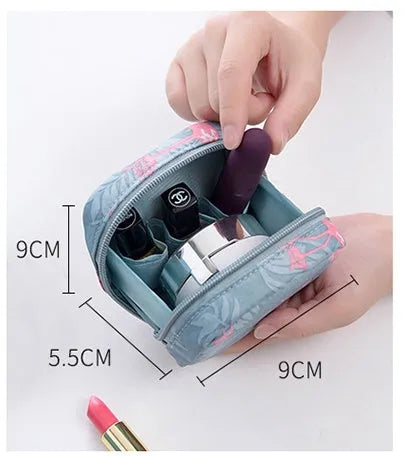 Blue cloth cube-shaped makeup storage bag with a plain pattern.