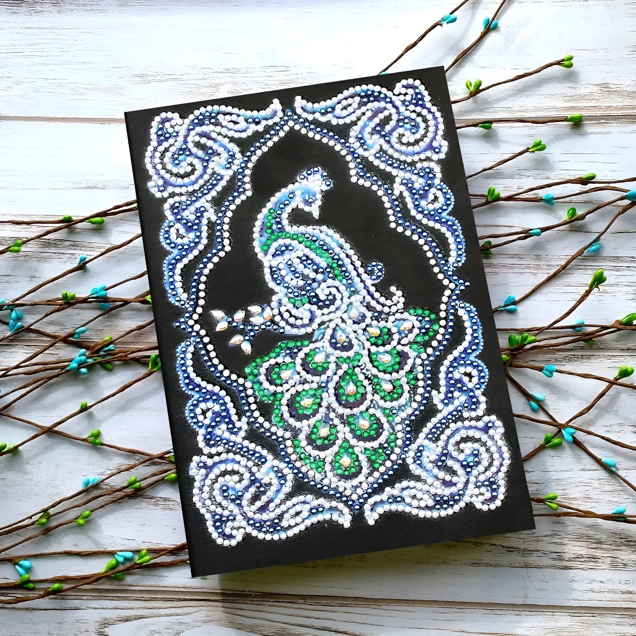 A5 diamond painting notebook with peacock design using shaped and bright drill crystals