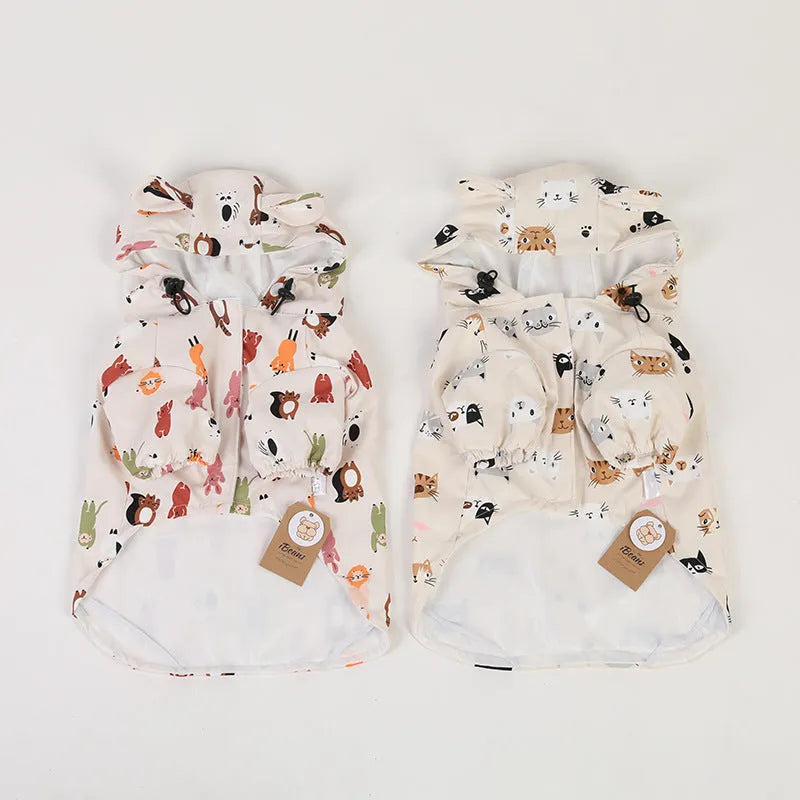 Beige dog raincoat with cartoon animal design showing waterproof PU construction