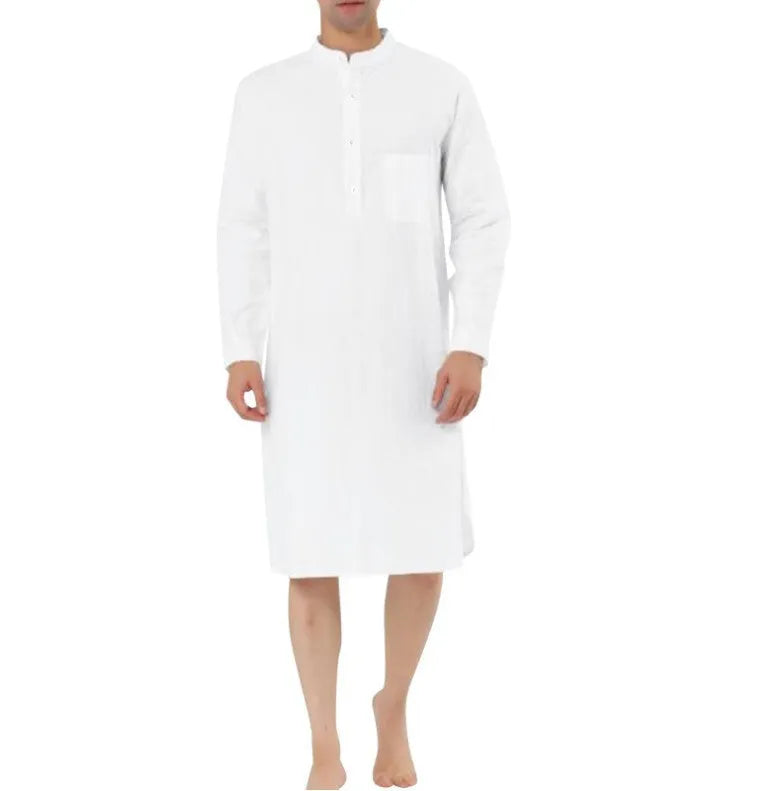 A man's simple cotton shirt robe in a light colour, shown hanging, with visible button front and pockets.