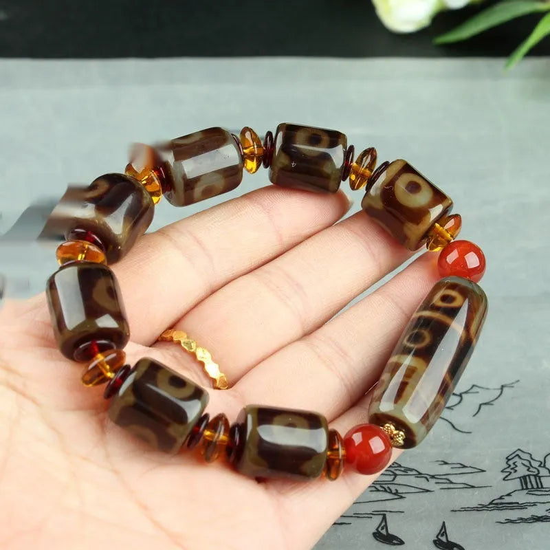 Distressed agate Tibet beads bracelet with three eye dzi design and polished stone beads