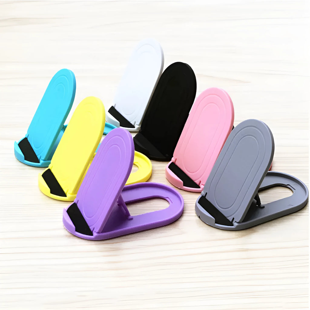 Plastic mobile phone stand with lazy bracket design in assorted colours on a desk.