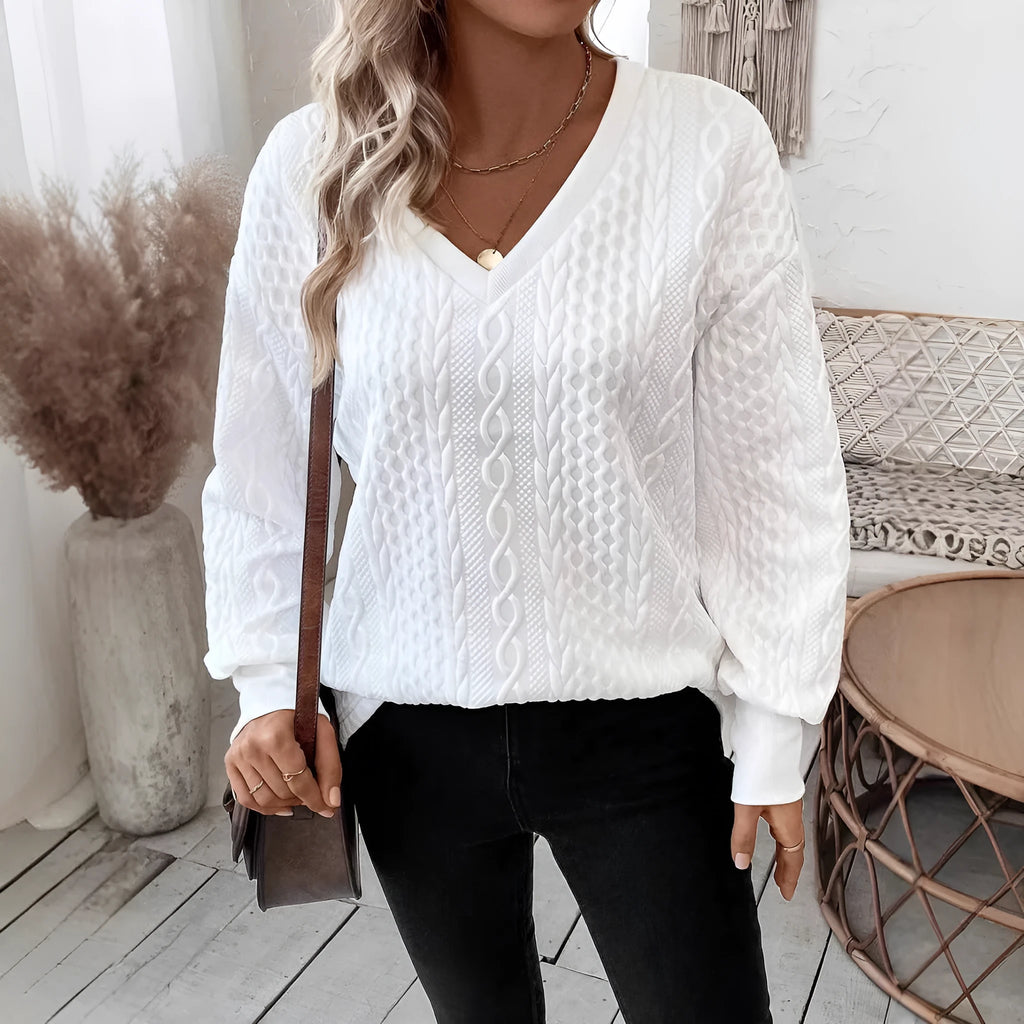 Milky white loose fit long sleeve T-shirt with a raised 3D pattern on the front.