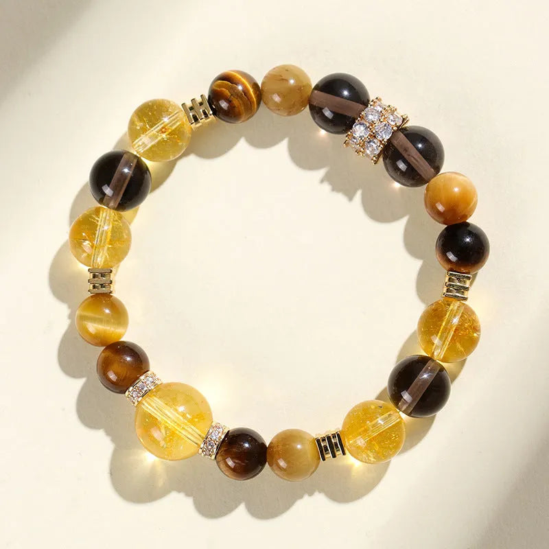 Natural yellow artificial crystal bead bracelet with 10mm tower beads on a string.