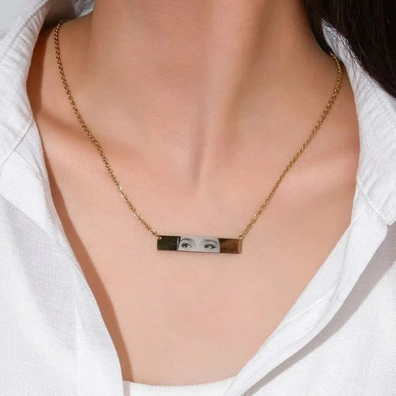 Custom stainless steel photo necklace with engraved eye design, geometric shape, and electroplating finish in a range of colours