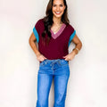 Burgundy women's V-neck short sleeve sweater with contrast trim cuffs and loose fit