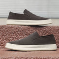 Men's casual slip-on shoes in apricot colour with round toe and mid heel, showing sewing line detail on artificial PU upper