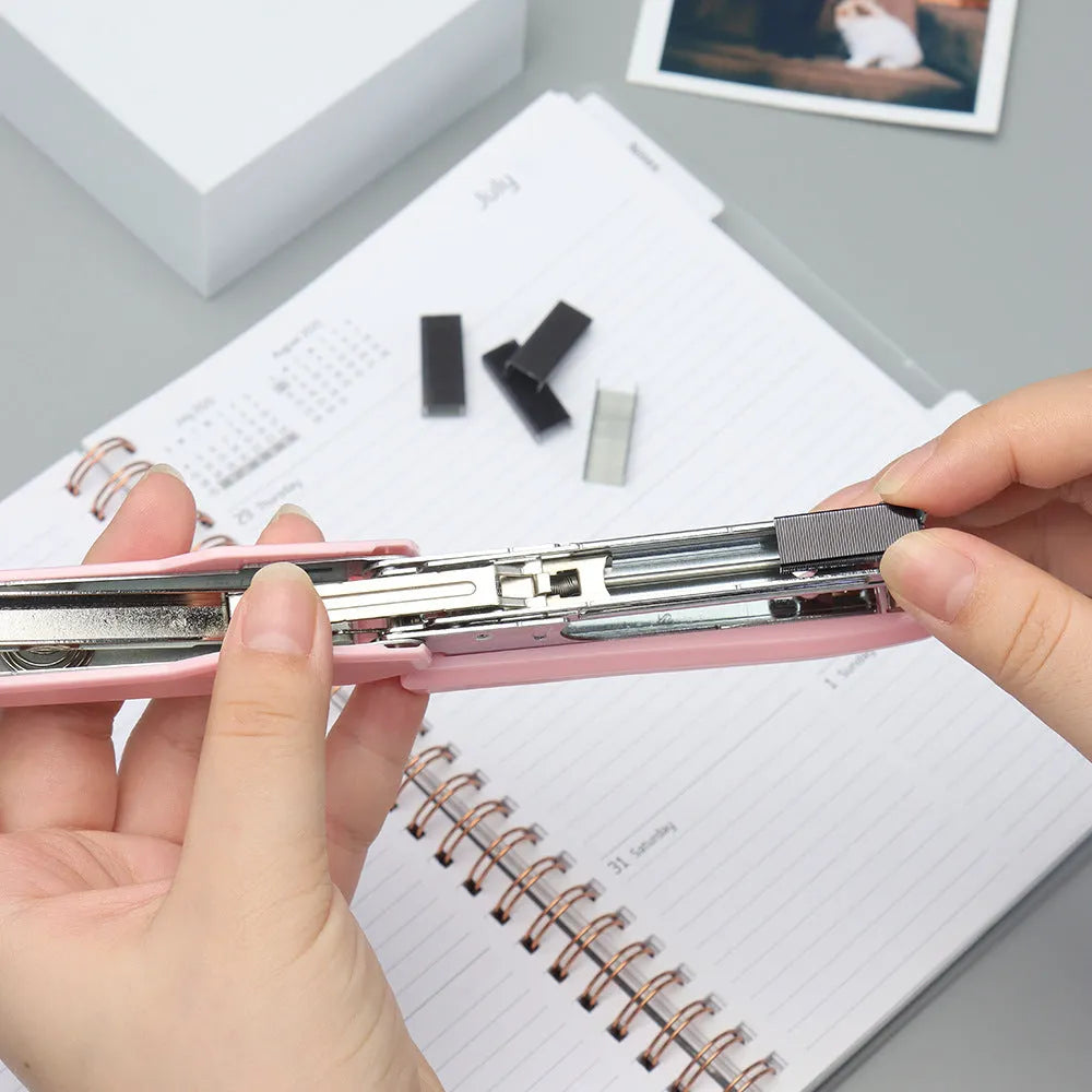 Box of 1000 metal office staples available in black, purple, rose gold, and rose red colours.