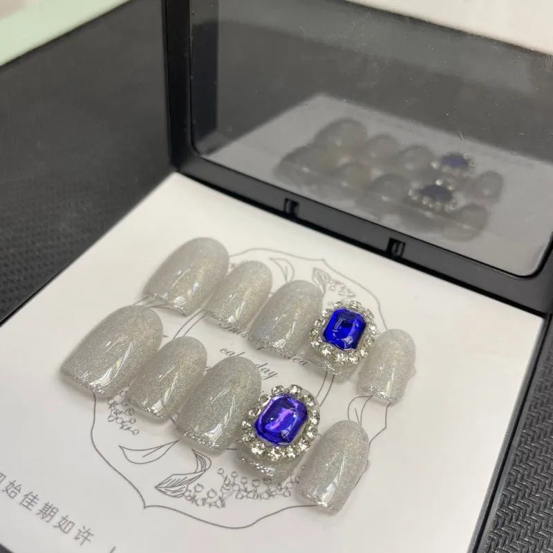 Handmade Sweet Star ladder pattern press-on nails in ultra-thin seamless style on a flat surface with glue and nail file