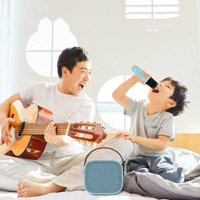Compact blue wireless Bluetooth portable speaker with built-in microphone on a table.