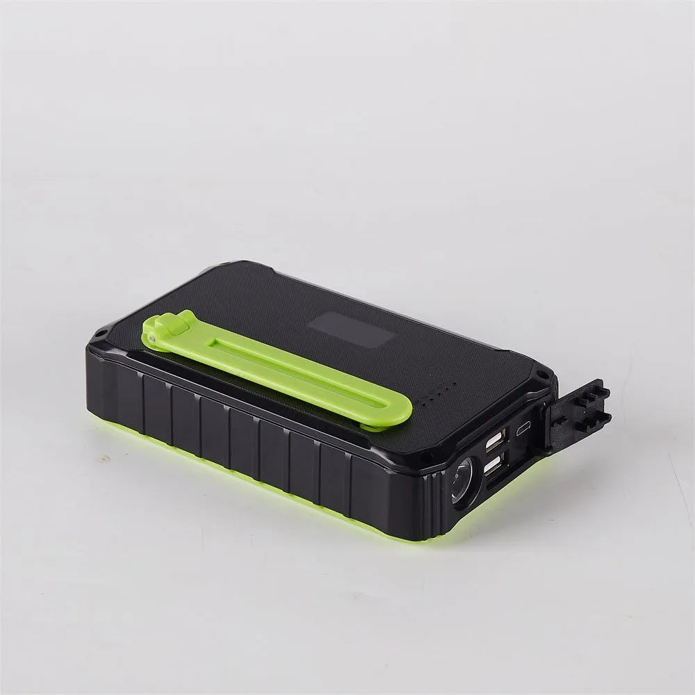 Green solar hand crank power bank with 12000mAh capacity showing USB ports and emergency LED light