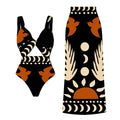 Women's black one-piece polyester swimsuit on a hanger, with other colour options visible.