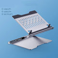 Aluminium alloy laptop stand with 8-in-1 docking station in deep space grey, cave-type design with silicone pads