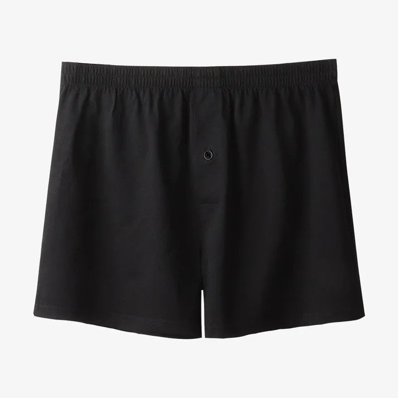 Men's high-waist cotton boxer shorts in black, grey, and navy blue on a size chart