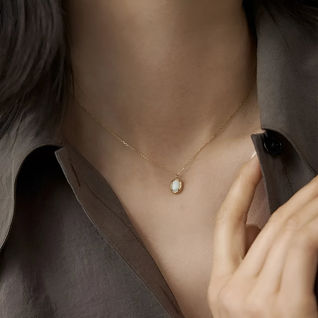 S925 sterling silver oval pendant necklace with a jelly opal stone, shown in gold and white gold plating options.