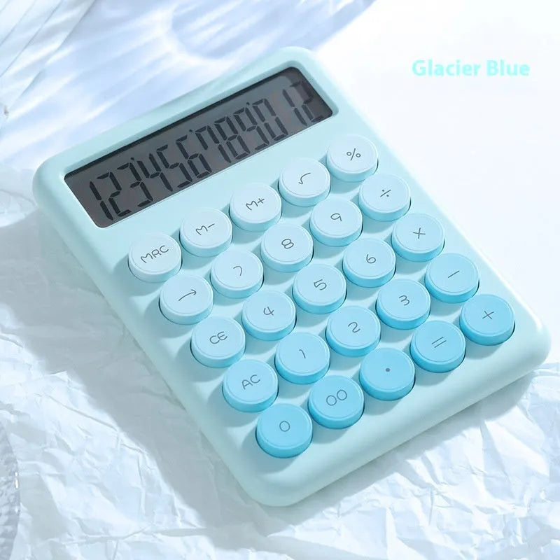 A gradient colour desk calculator on a desk, showing violet, mint green, blue, and pink colour options.