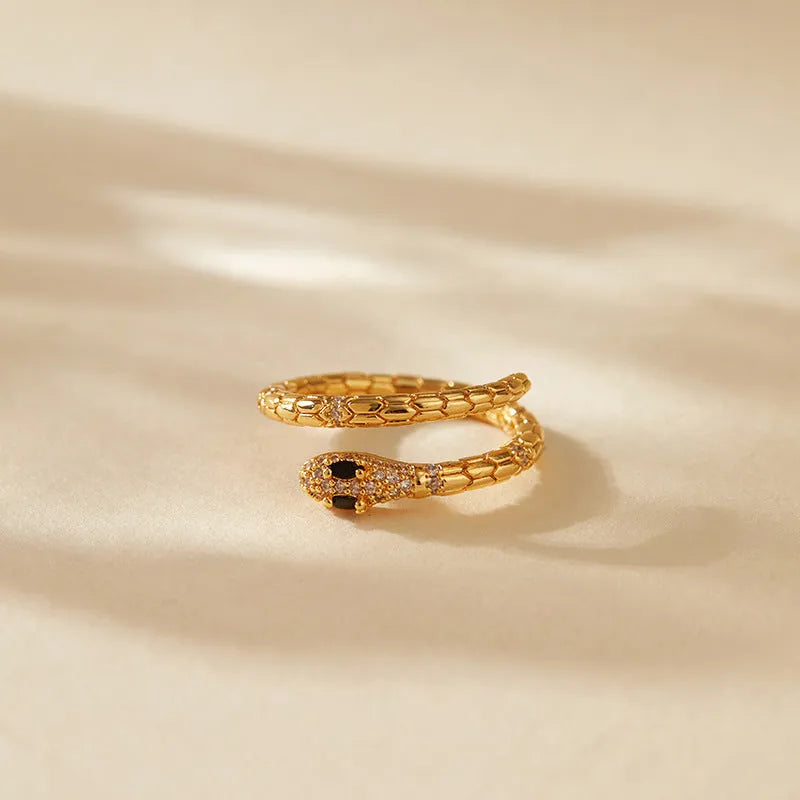 Adjustable snake finger ring for women in gold colour with diamond treatment on copper