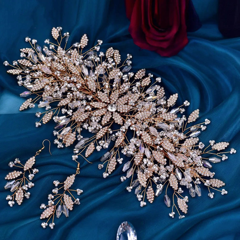 Gold rhinestone wave bridal headpiece and matching earrings set on display