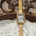 Women's rectangular white gold Milan belt watch with white face and steel strap