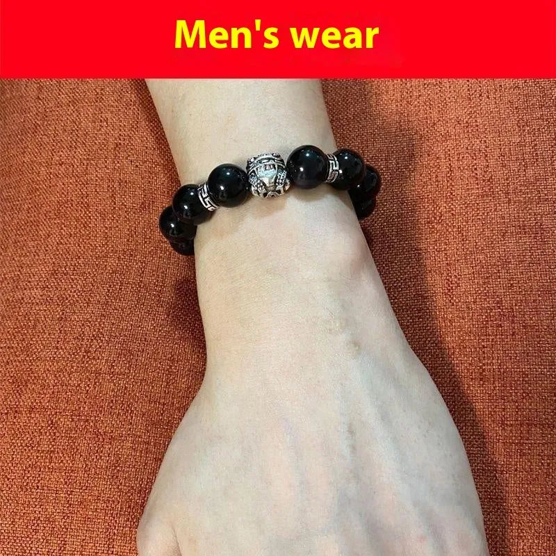 Obsidian bracelet with natural cloud pattern and silver clasp shown in male 12mm and female 10mm sizes.