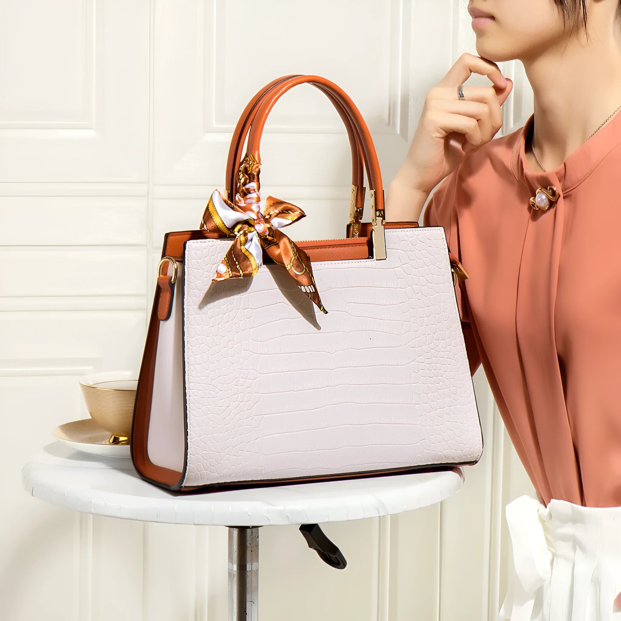 Milky white women's PU leather handbag with horizontal square shape and multiple interior compartments