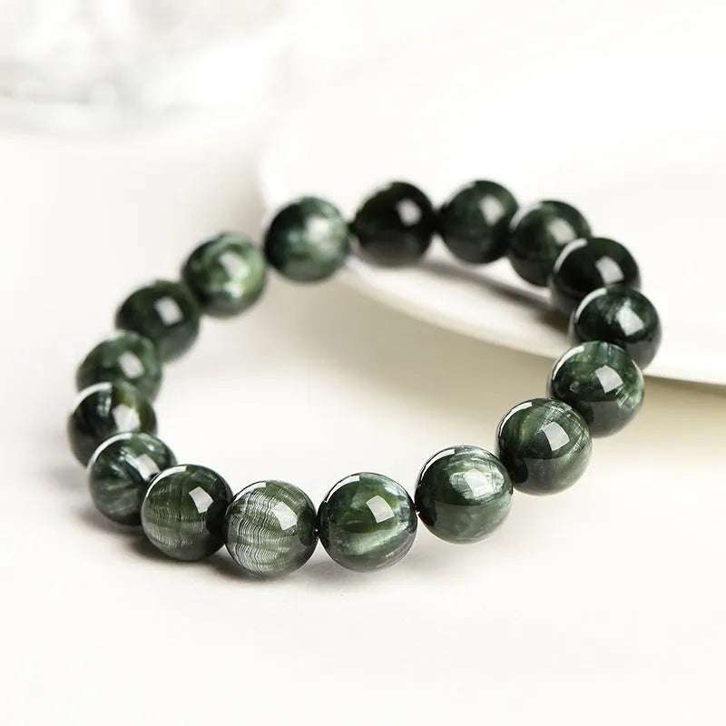 Green Dragon Crystal bracelet with round beads and a ruyi decorative motif.