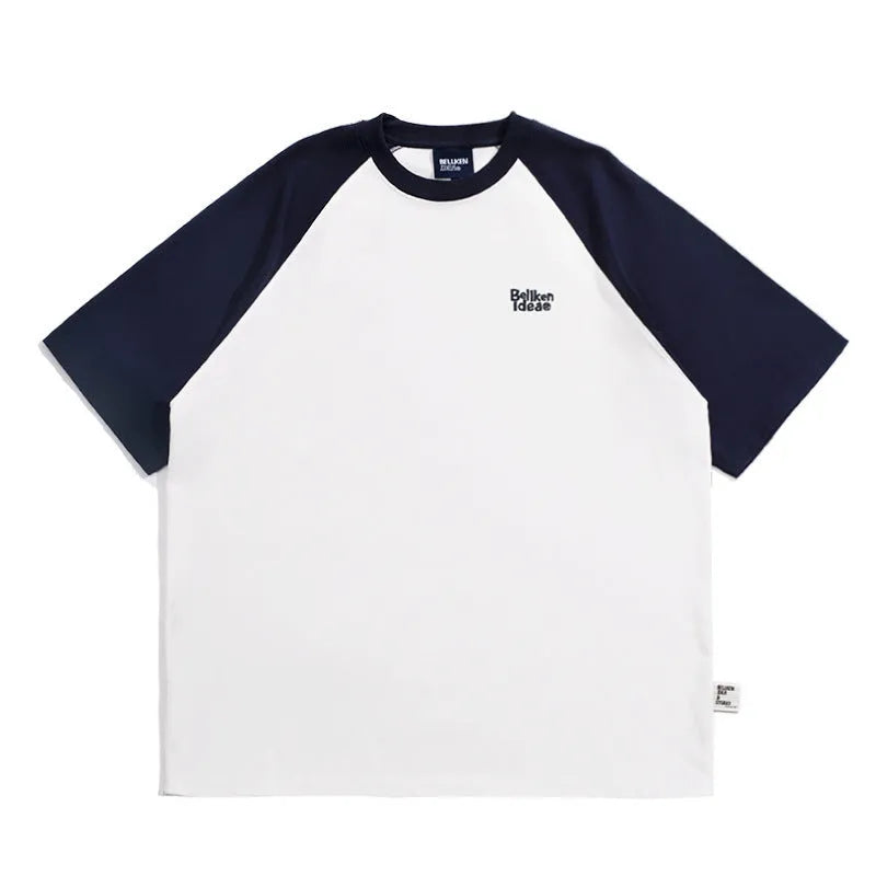 Man wearing a loose-fit grey raglan sleeve T-shirt, Japanese casual style.