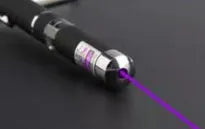 Three metal laser pens in green, purple, and red light colours for dog and cat chasing play