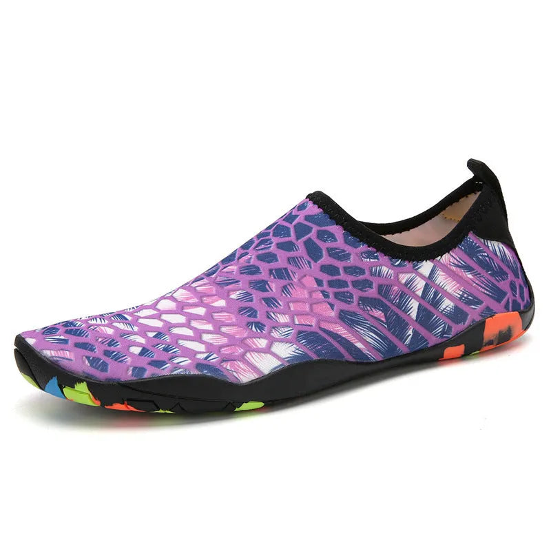 Men's and women's beach wading shoes in blue, with Lycra upper and EVA midsole, on a sandy background.