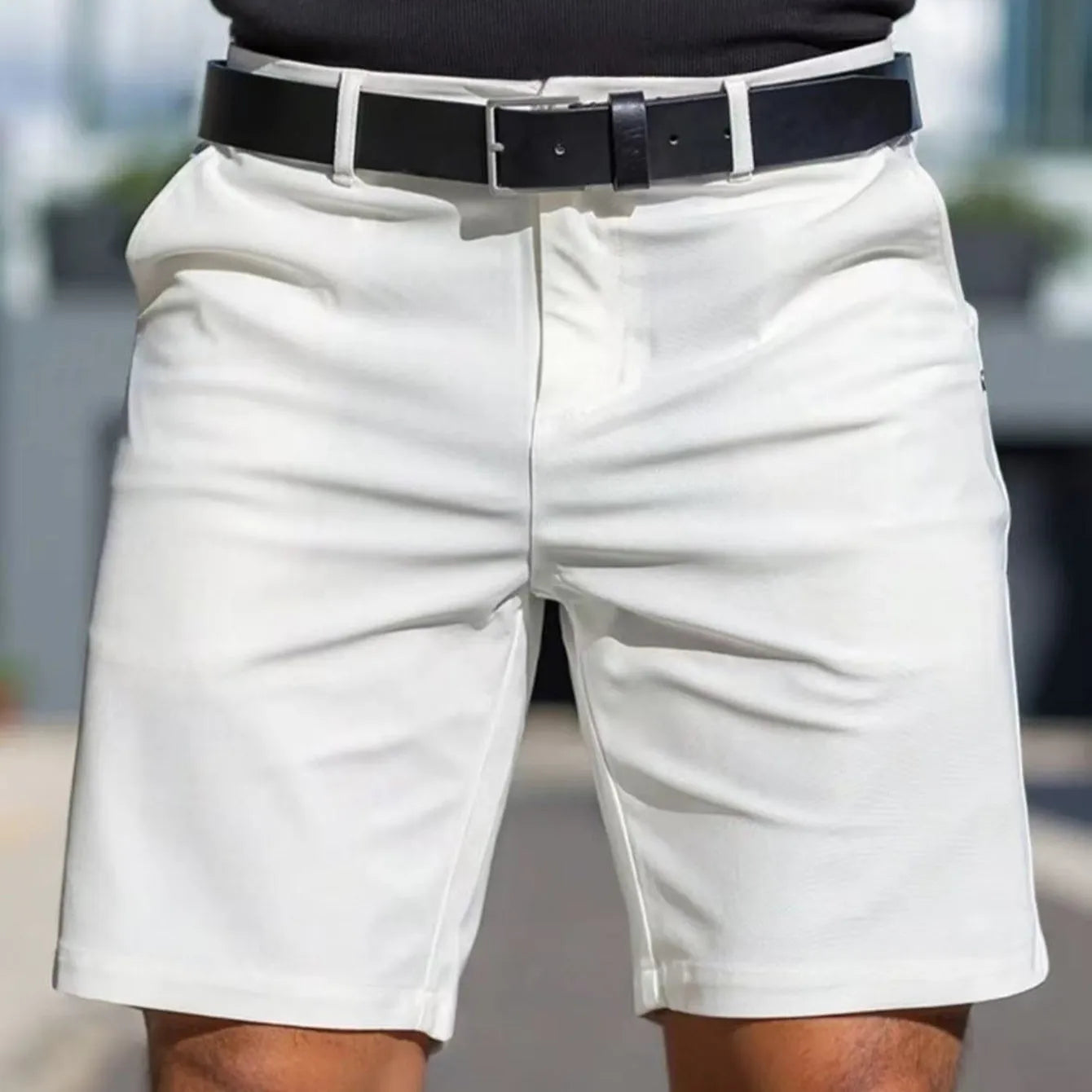Men's solid colour straight cut polyester shorts in apricot, shown in a fifth pants length with micro-elastic fabric.