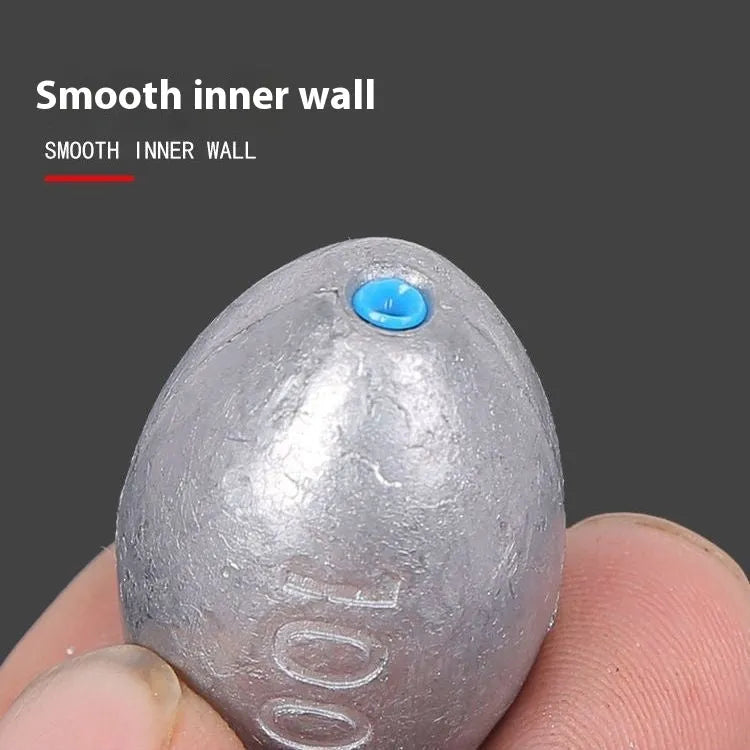 Scale pattern tongxin olive lead fishing sinker with plastic core in rugby shape.
