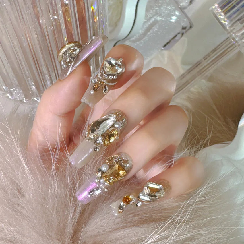 Pack of flash style false nail patches with luxury rhinestones on a card, showing jelly adhesive and tool set options.