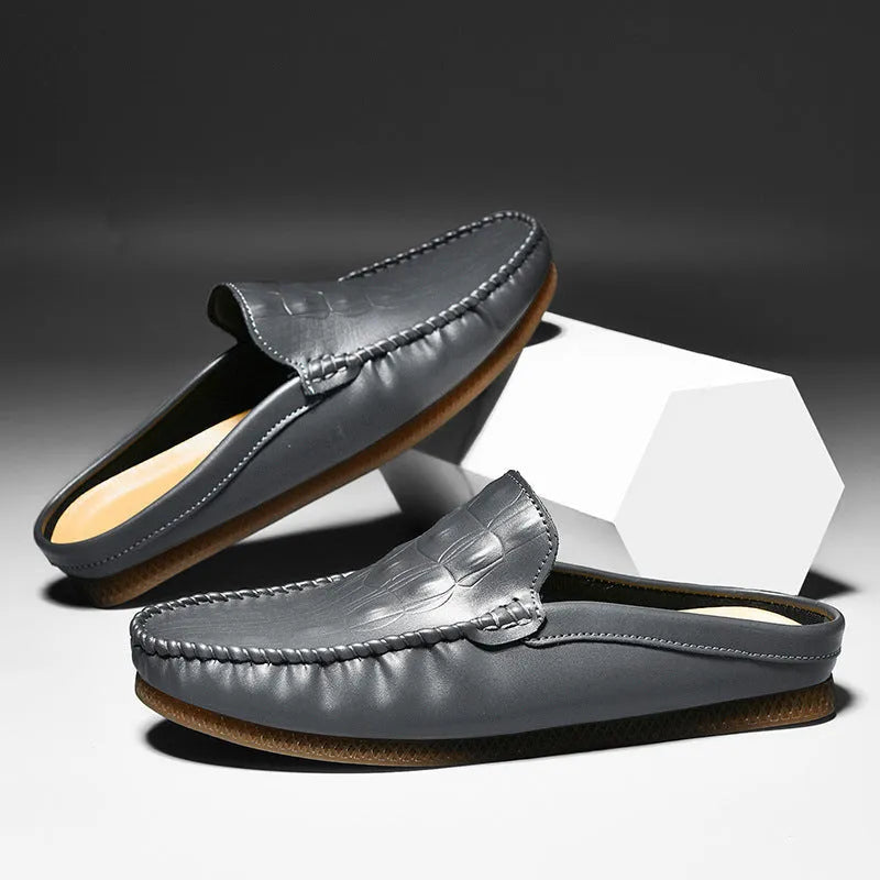 Men's black Gommino-style leisure semi-slippers with artificial PU upper and rubber sole on a white background.