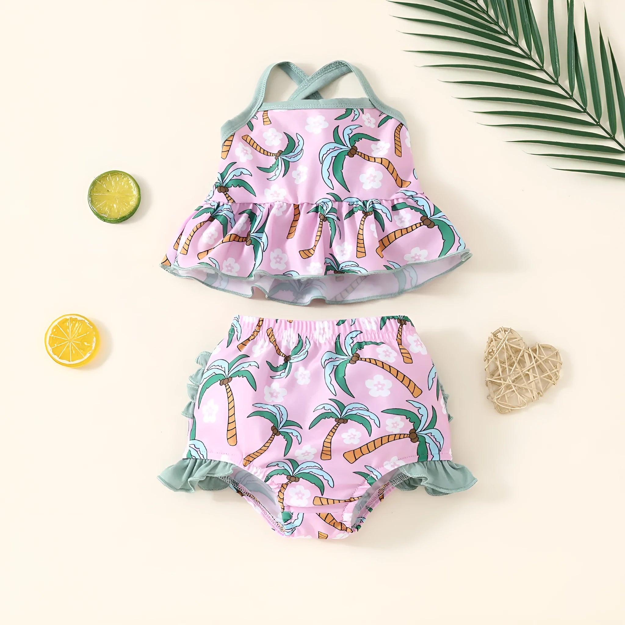 White children's sweet style swimsuit set with shirt and shorts on a hanger.